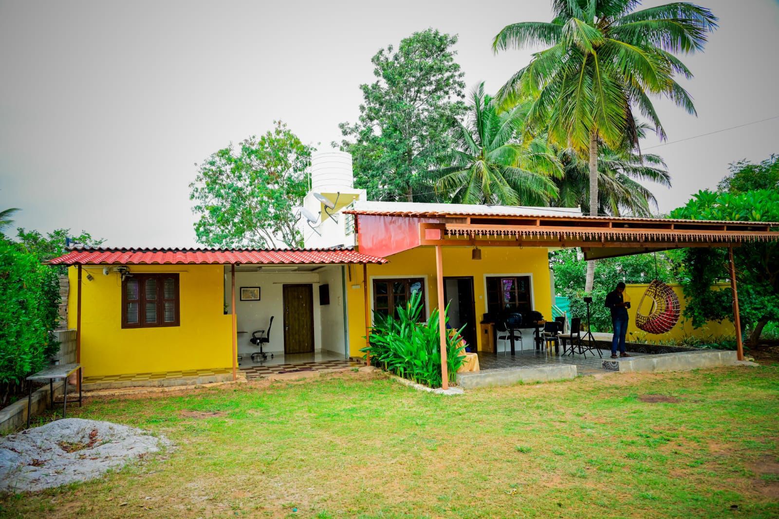 Farmland Homestay grounds surrounded by green farmland