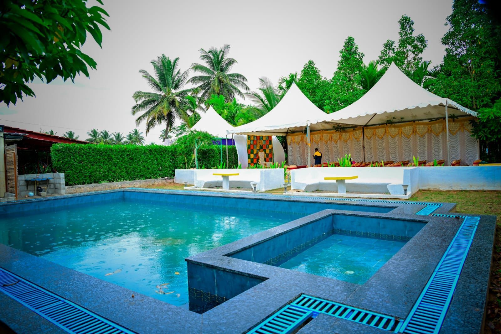 Swimming pool and outdoor event seating at Farmland Homestay