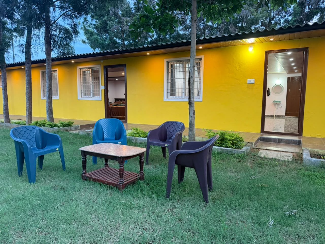 Yellow cottage with lawn seating